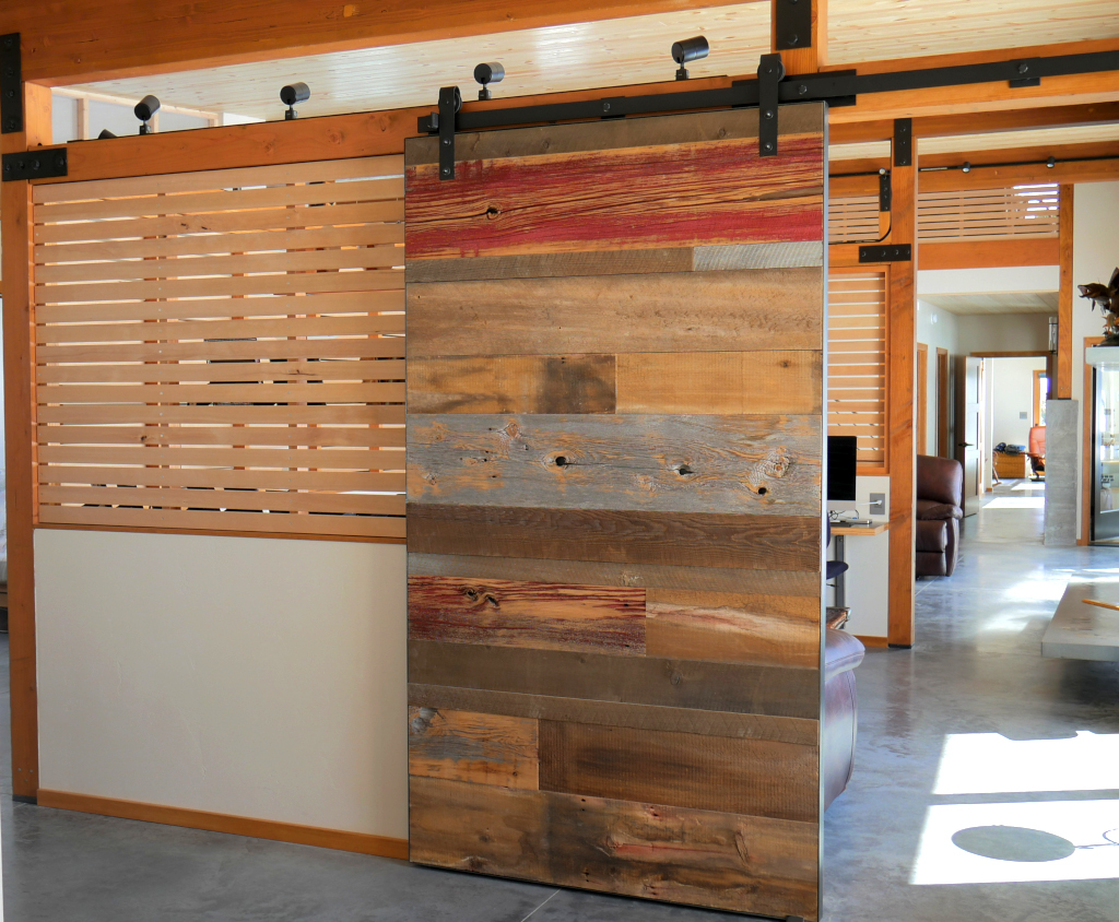 Built design of barndoor and wooden slated shoji screen wall.
