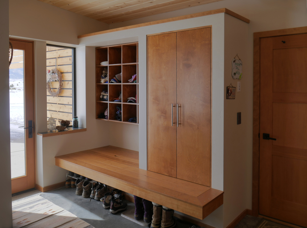 Beautiful design of entry bench with  coat closet and cubbies.